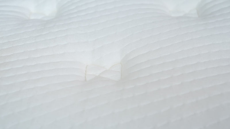 Feeling the smooth soft and breathable bamboo fabric of Elmira Hybrid mattress